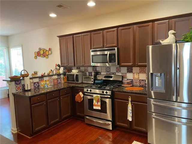 an aerial view of a house with outdoor space and street view
