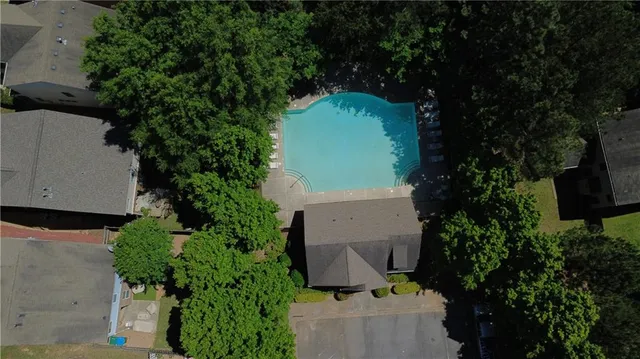 a bathroom with a double vanity sink mirror and bathtub