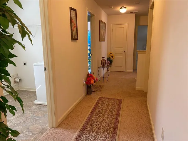 an aerial view of residential house with outdoor space and trees