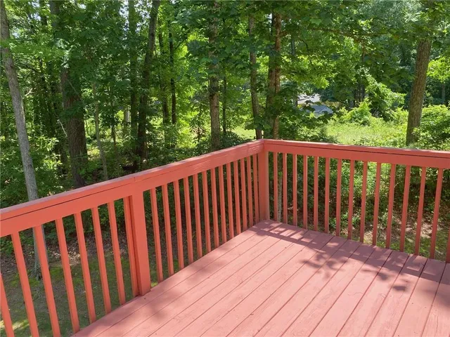 an aerial view of a house with yard
