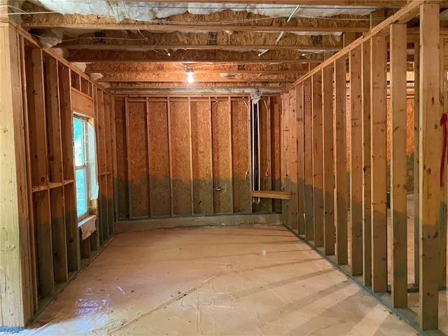 a view of storage and utility room with washer and dryer