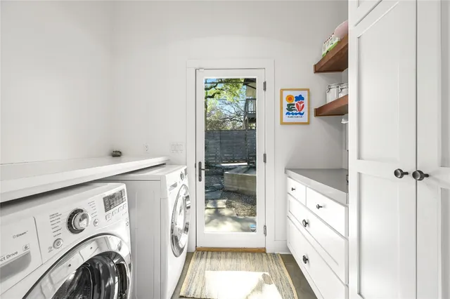 a living room with a couch and a potted plant