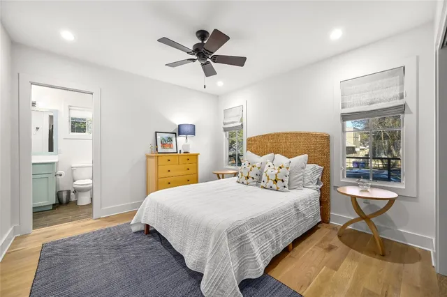 a bathroom with a double vanity sink toilet and shower
