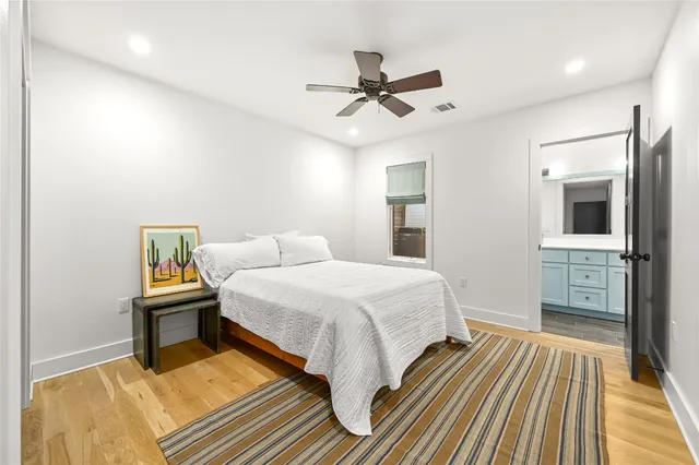 a bathroom with a tub and a view of a bathtub