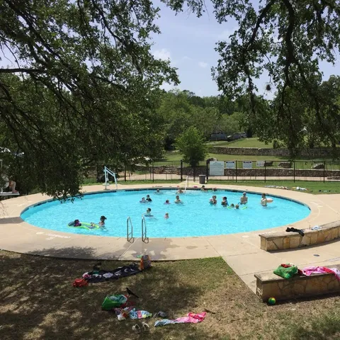 a childrens park with lots of swings and slides