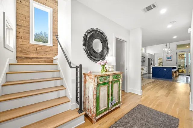 a view of living room with furniture and a fireplace