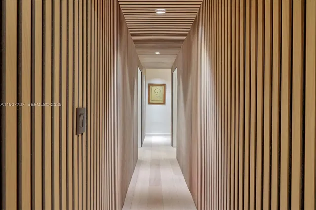 a view of a hallway with a wooden floor