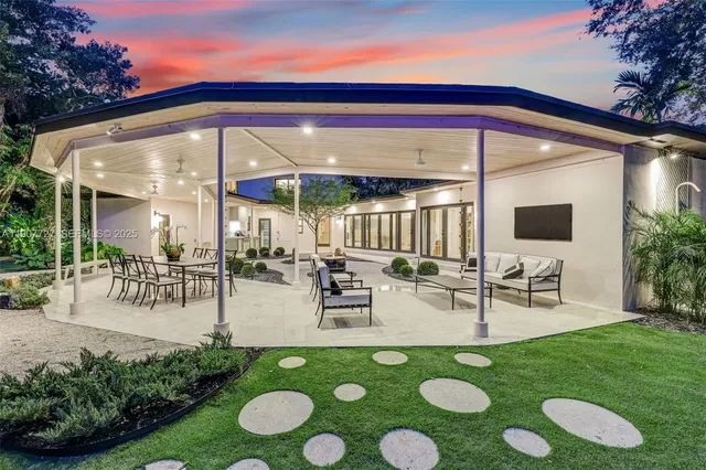 a view of an chairs and tables in the patio