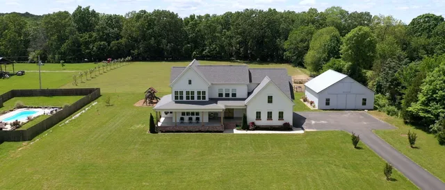 a aerial view of a house with a big yard