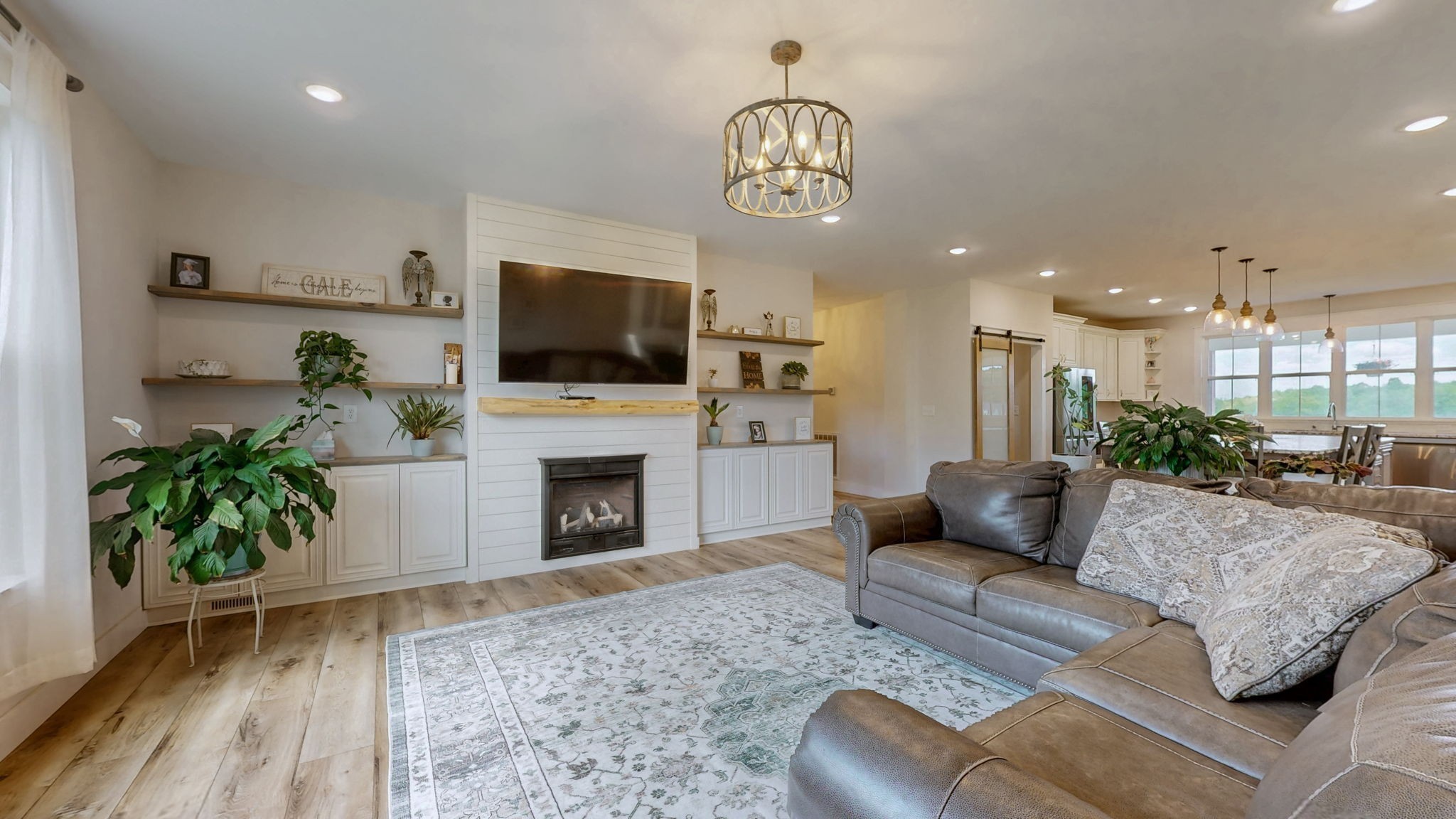 548 Buddy Road Burns, TN 37029 - Photo 12 of 47 a living room with furniture a fireplace and a flat screen tv
