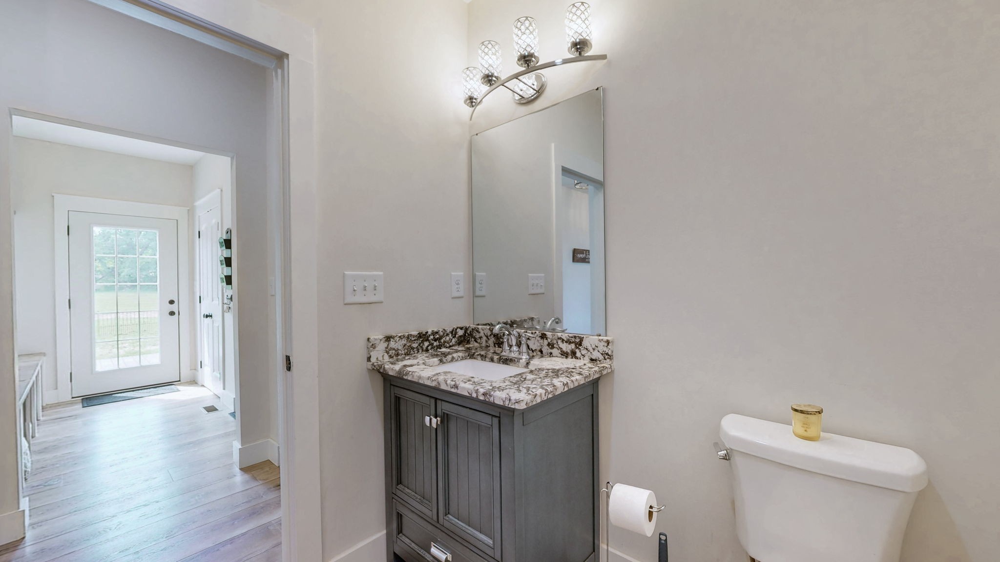 548 Buddy Road Burns, TN 37029 - Photo 14 of 47 a bathroom with a granite countertop sink and a toilet