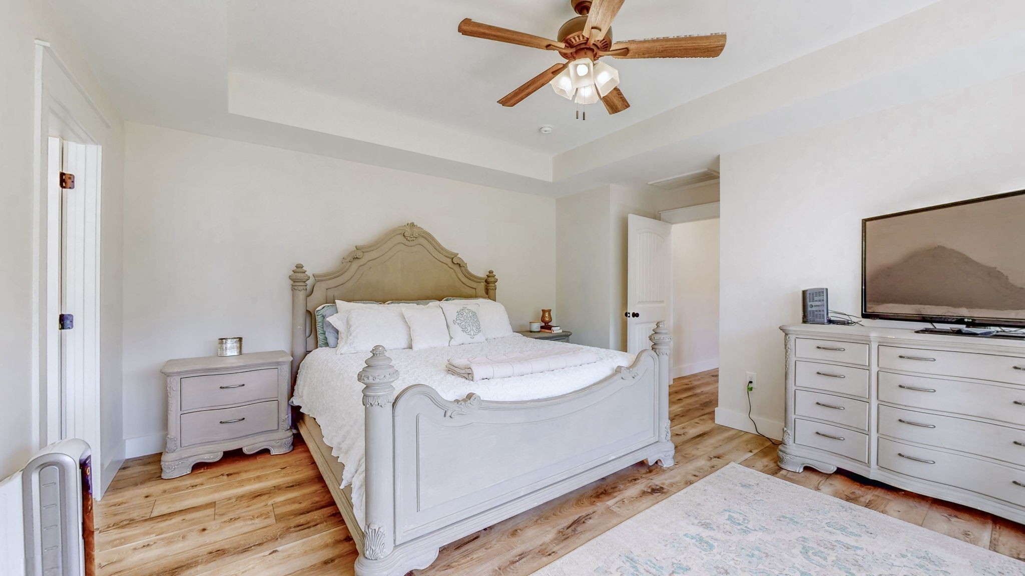 548 Buddy Road Burns, TN 37029 - Photo 16 of 47 a bed room with a bed and a television