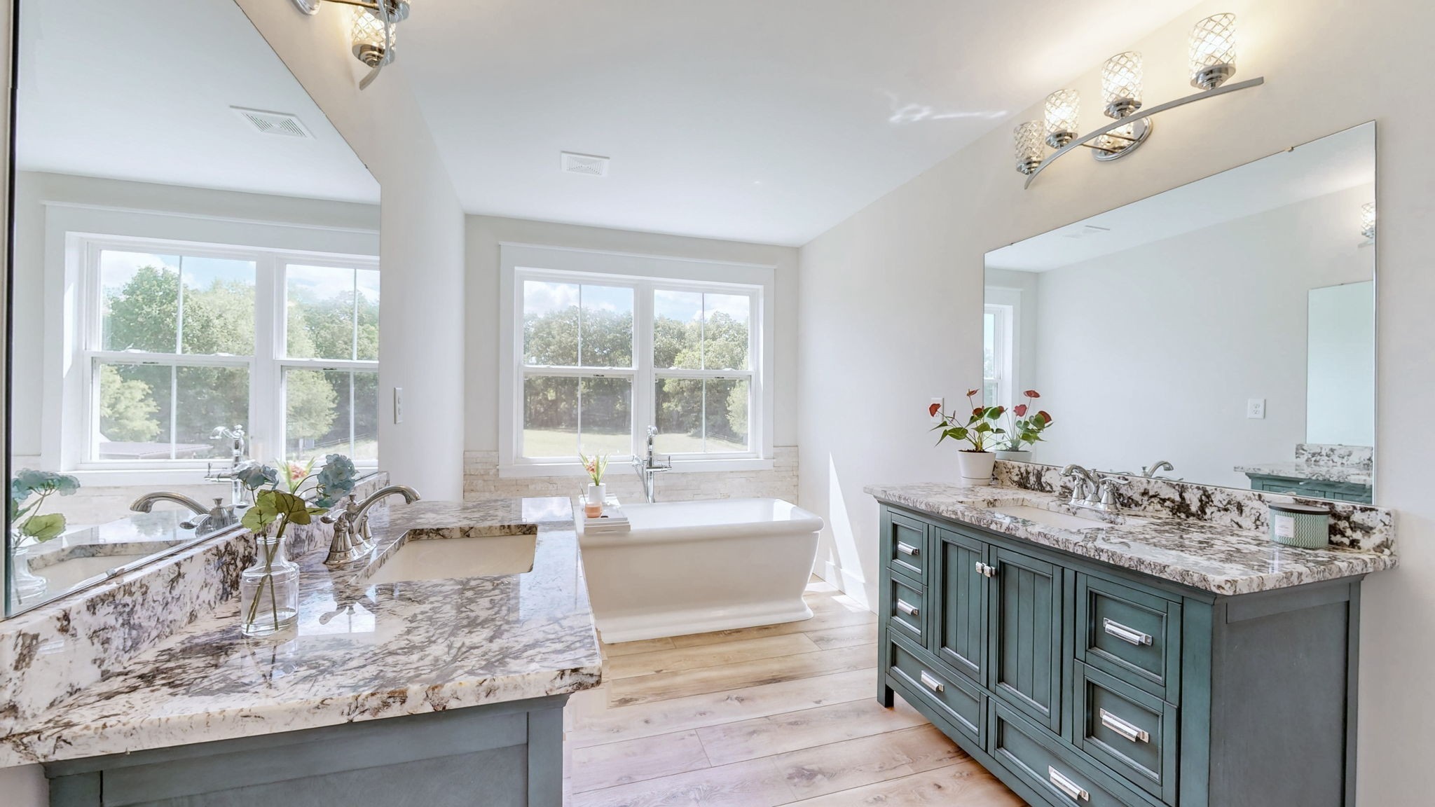 548 Buddy Road Burns, TN 37029 - Photo 18 of 47 a bathroom with a granite countertop sink a large mirror and a bathtub