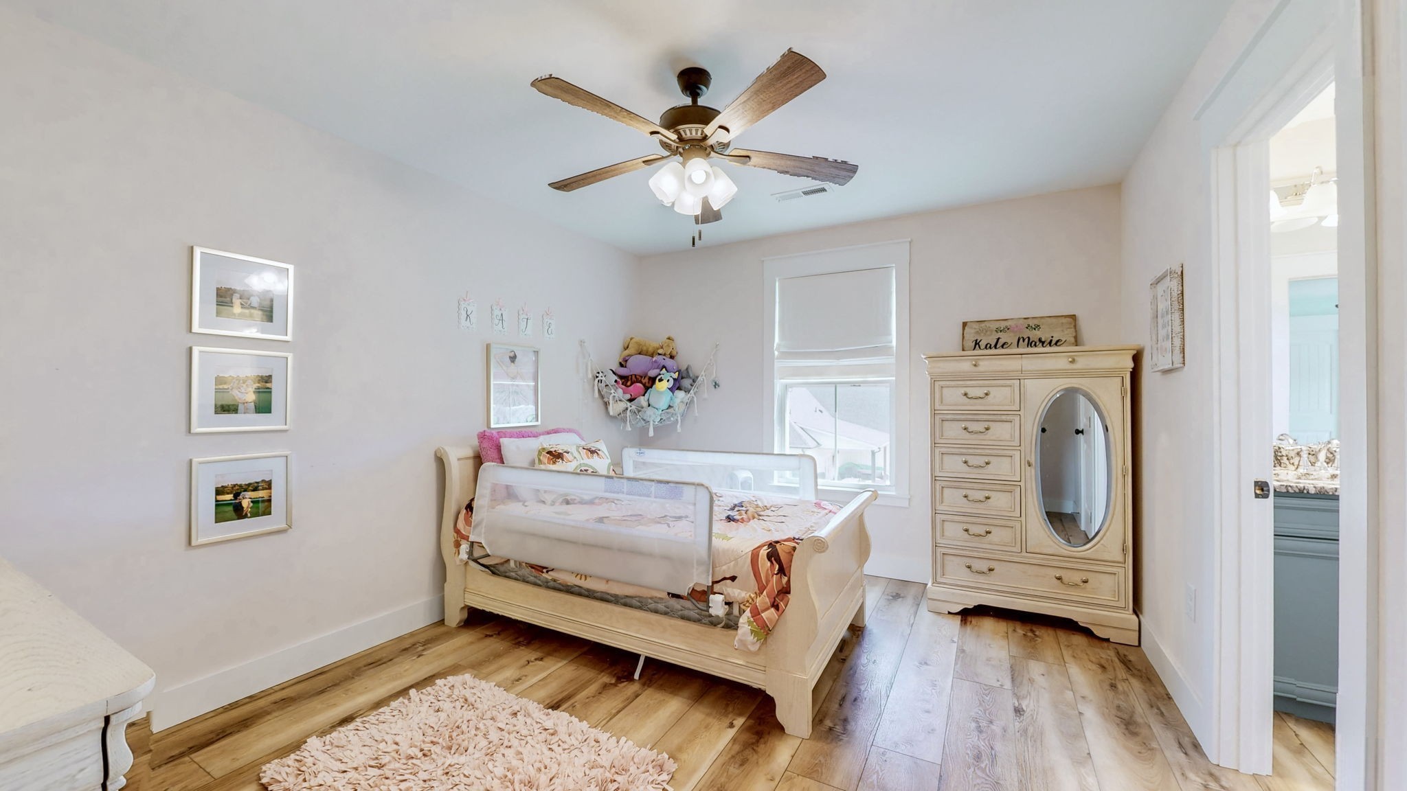 548 Buddy Road Burns, TN 37029 - Photo 23 of 47 a bedroom with furniture and wooden floor