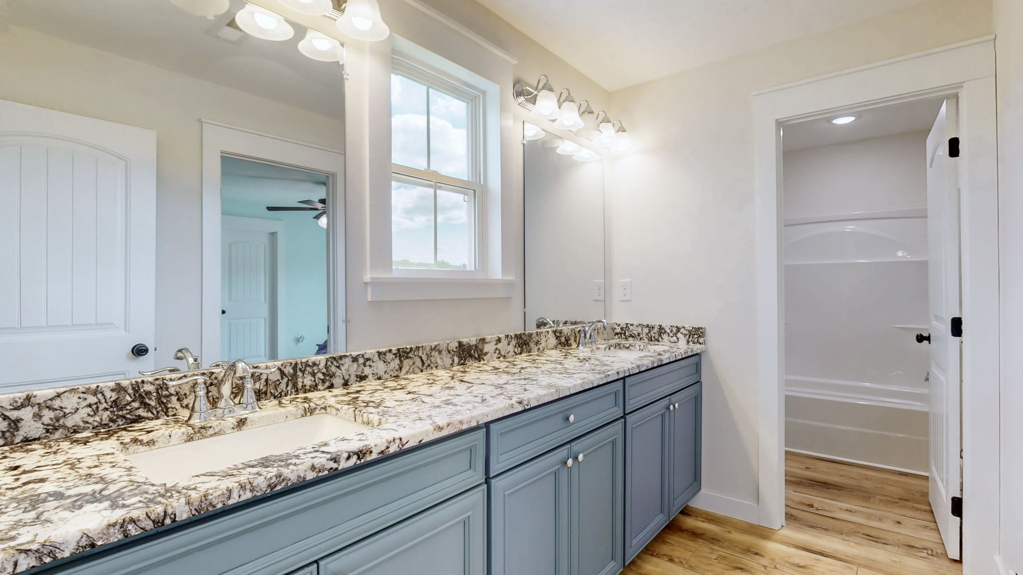 548 Buddy Road Burns, TN 37029 - Photo 25 of 47 a bathroom with a granite countertop sink and a mirror