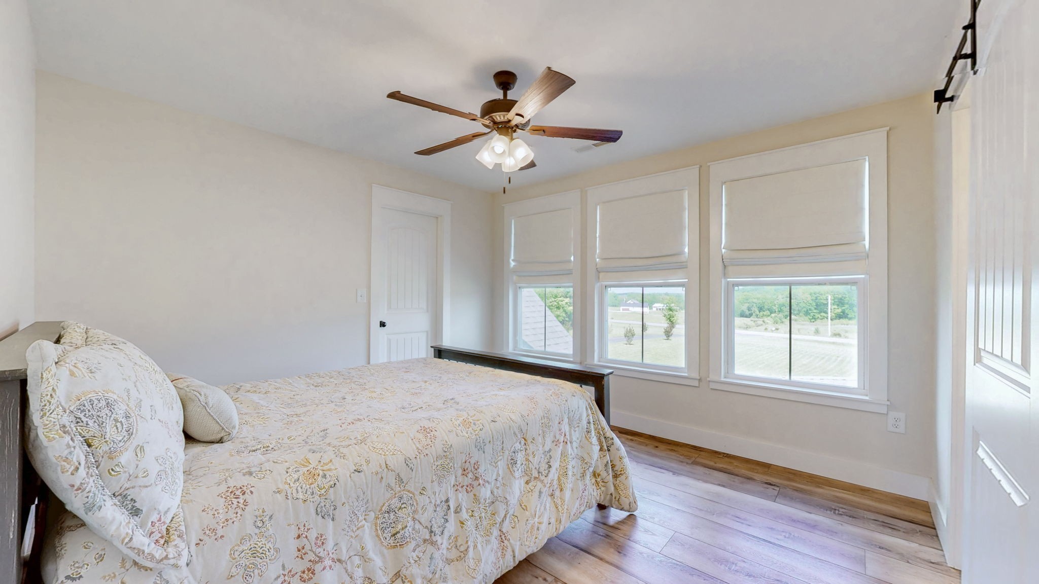 548 Buddy Road Burns, TN 37029 - Photo 26 of 47 a bedroom with a large bed and a window