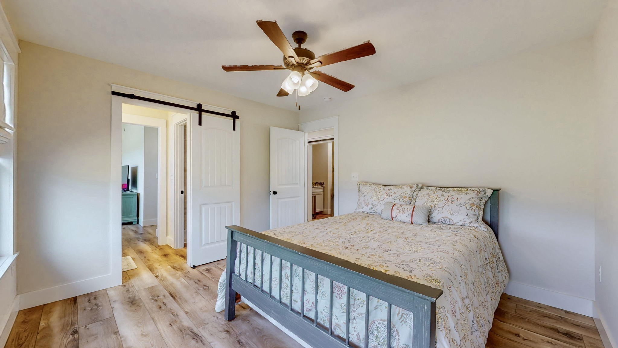 548 Buddy Road Burns, TN 37029 - Photo 27 of 47 a bedroom with a bed and wooden floor