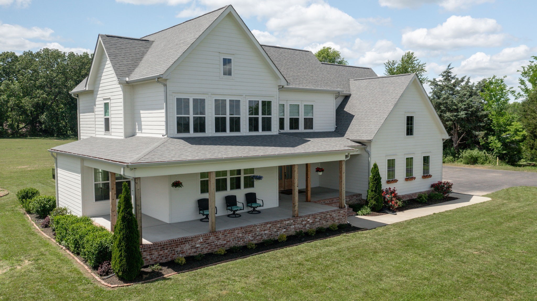 548 Buddy Road Burns, TN 37029 - Photo 32 of 47 a front view of a house with a yard and porch