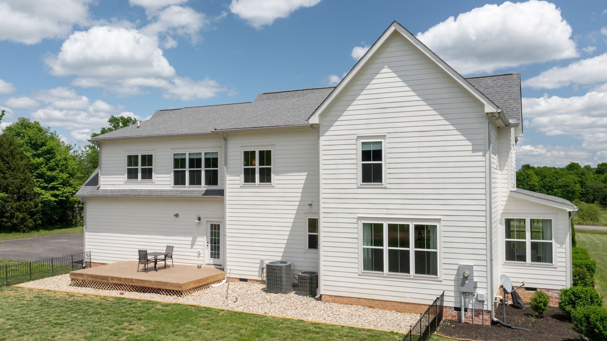 548 Buddy Road Burns, TN 37029 - Photo 38 of 47 a view of a white house with a sink and a yard