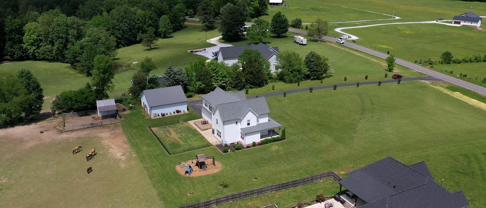 548 Buddy Road Burns, TN 37029 - Photo 42 of 47 an aerial view of a house with a garden