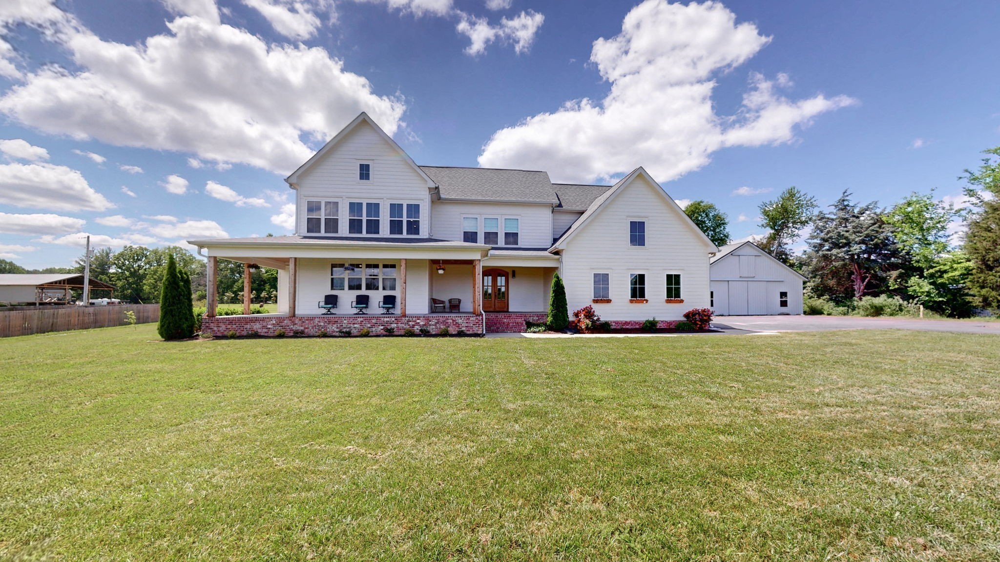548 Buddy Road Burns, TN 37029 - Photo 44 of 47 a front view of a house with garden