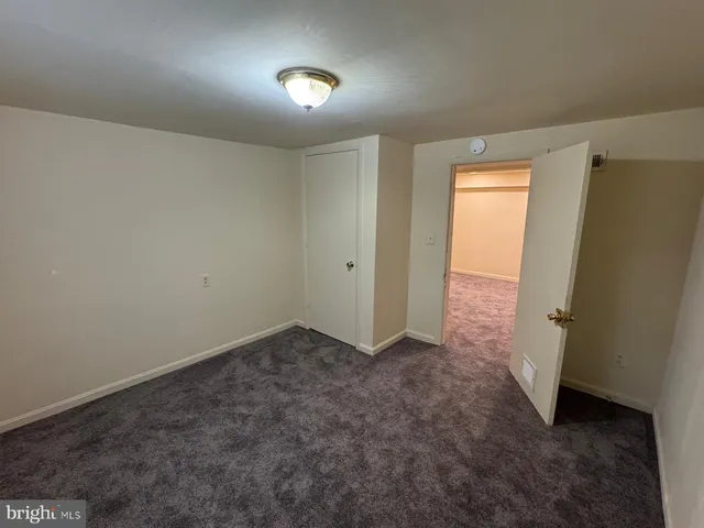 an empty room with a empty space and windows