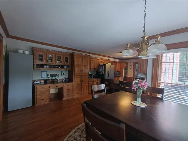 a living room with fireplace furniture and a wooden floor