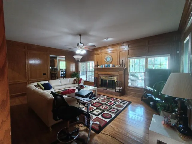 a living room with furniture and a fireplace