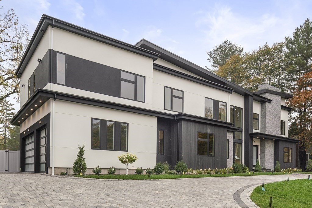 34 Rachel Road Newton, MA 02459 - Photo 3 of 9 a front view of a house with garden