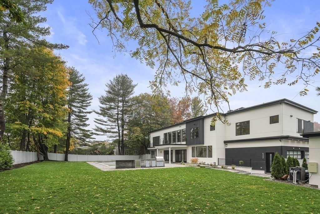 34 Rachel Road Newton, MA 02459 - Photo 5 of 9 a front view of a house with a yard and trees