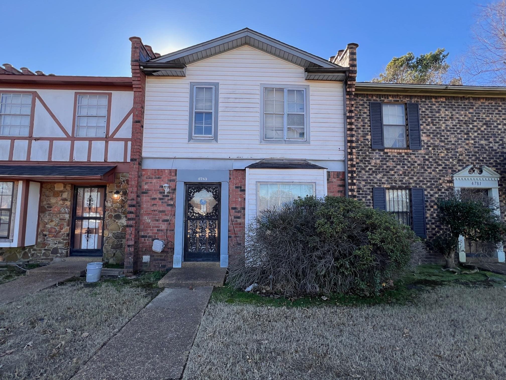 4783 Winchester Road Memphis, TN 38118 - Photo 1 of 14 View of front facade with brick siding and a chimney