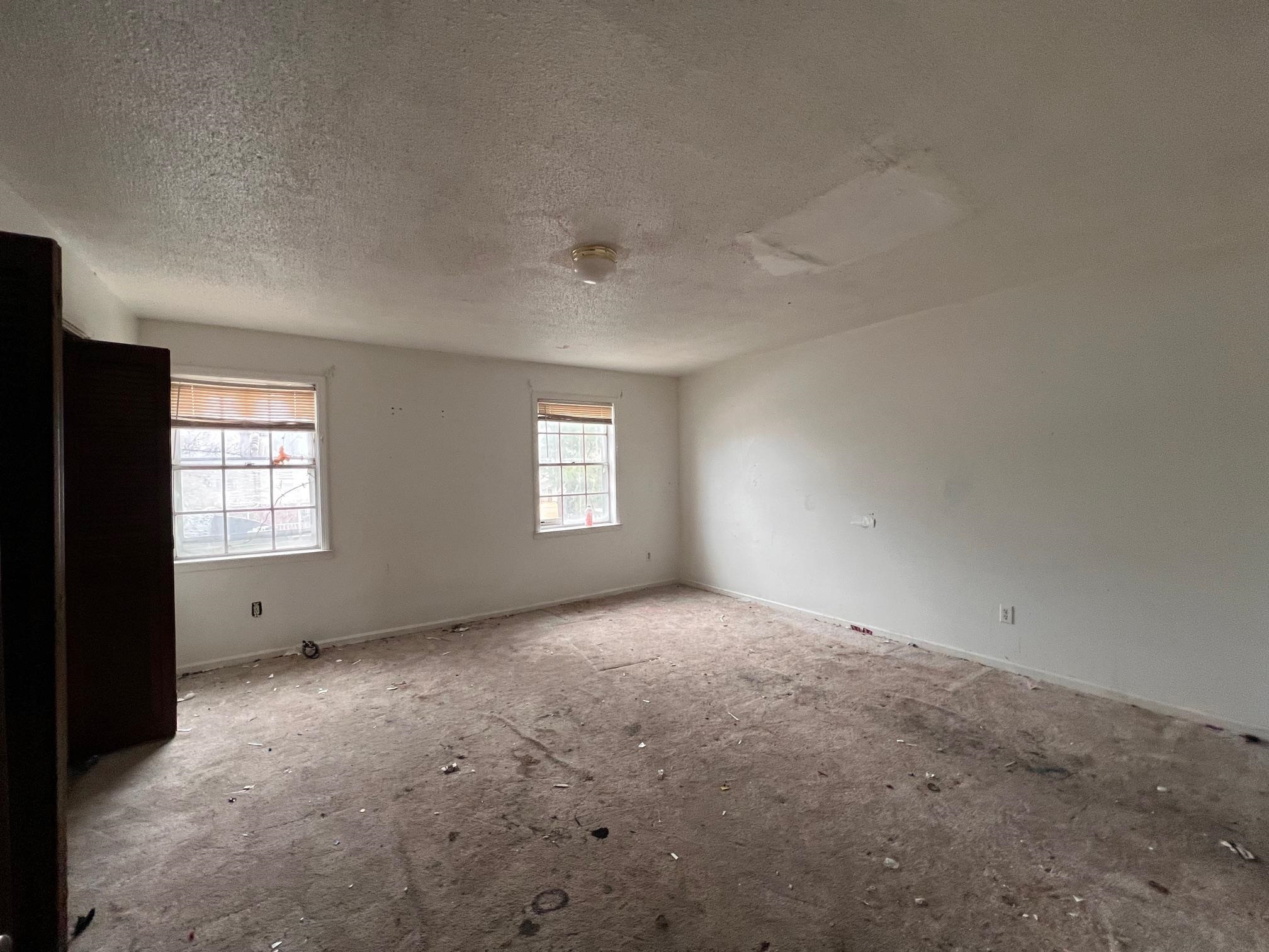 4783 Winchester Road Memphis, TN 38118 - Photo 13 of 14 Unfurnished room with baseboards and a textured ceiling