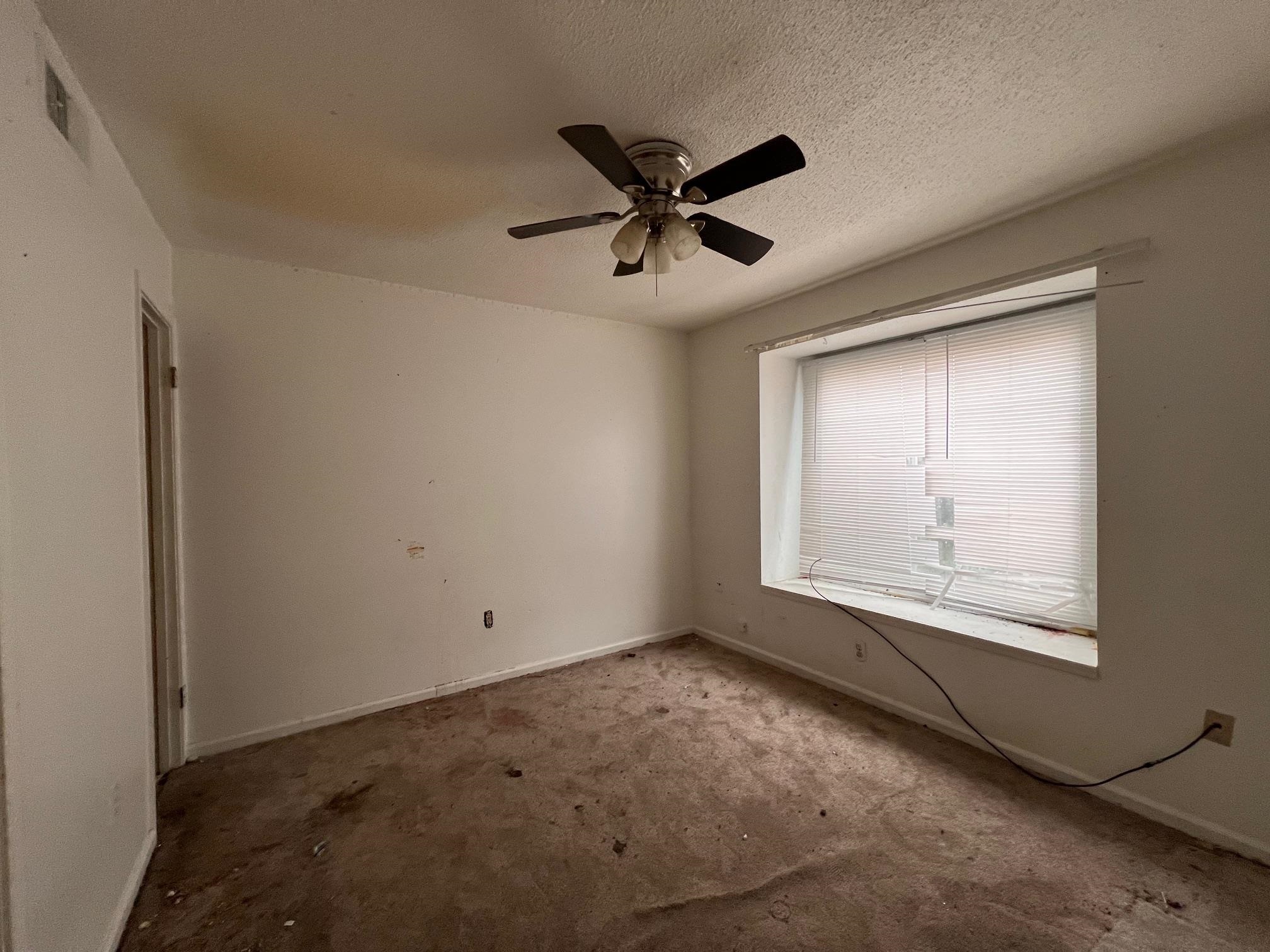 4783 Winchester Road Memphis, TN 38118 - Photo 4 of 14 Empty room featuring ceiling fan, a textured ceiling, and carpet