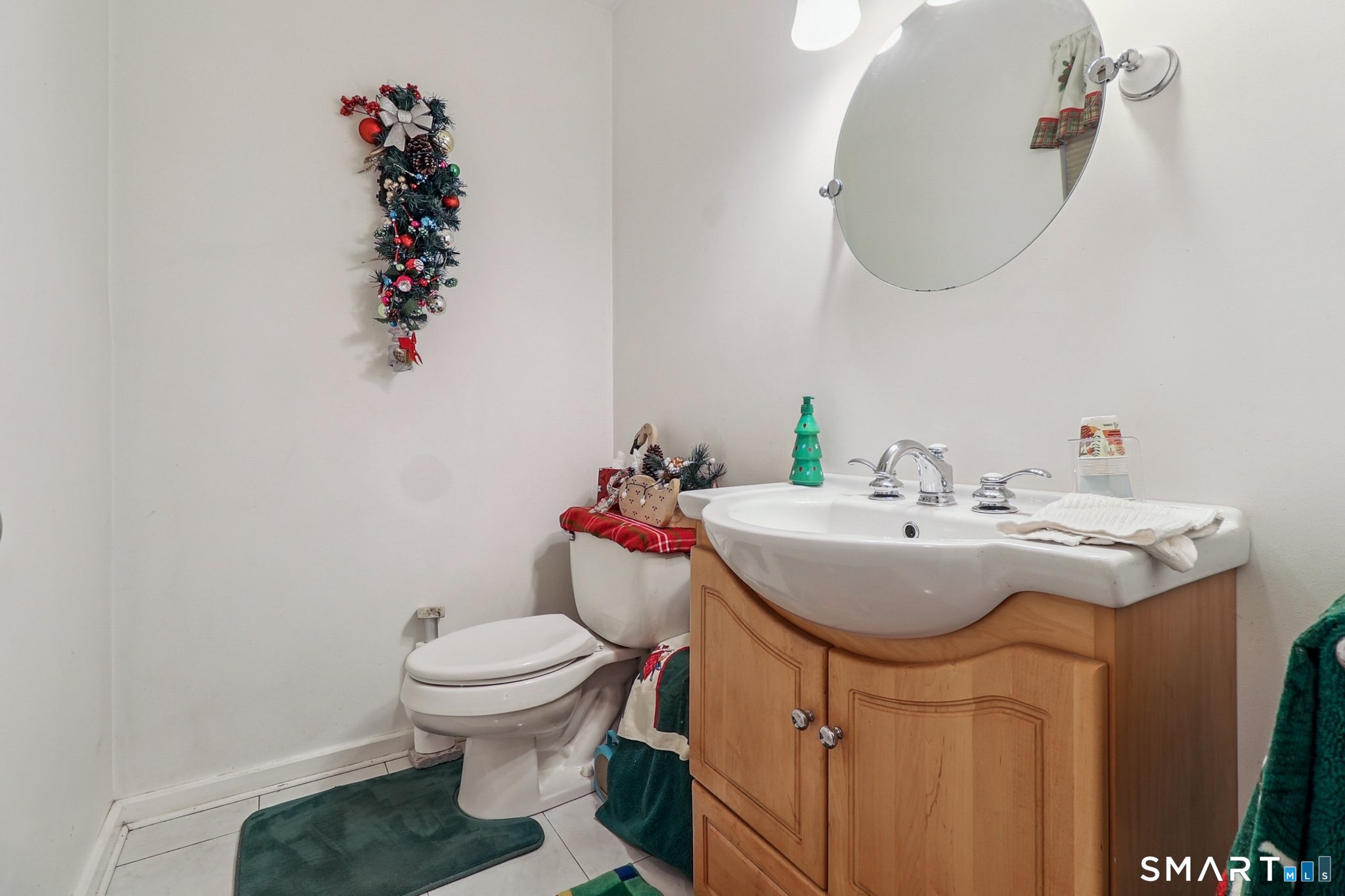 36 Spinning Wheel Road Monroe, CT 06468 - Photo 12 of 25 a bathroom with a sink toilet and a mirror