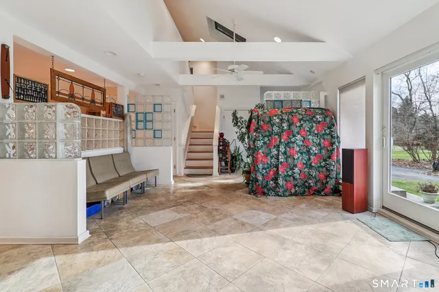 a view of entryway with stairs and a couch