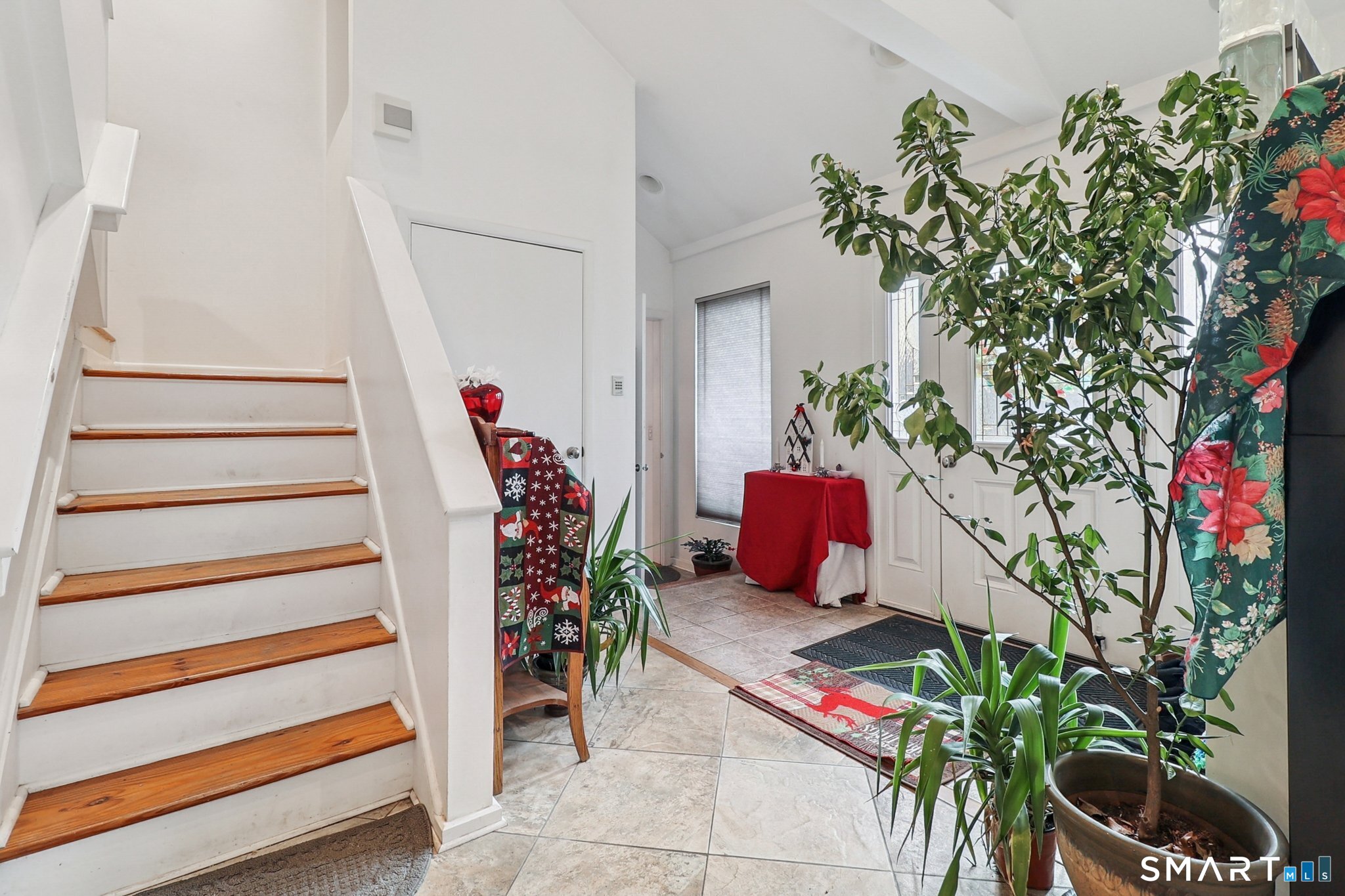 36 Spinning Wheel Road Monroe, CT 06468 - Photo 10 of 25 a vase of flowers sitting on a floor