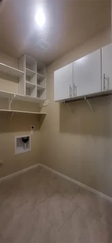 a kitchen with stainless steel appliances a refrigerator and a stove top oven