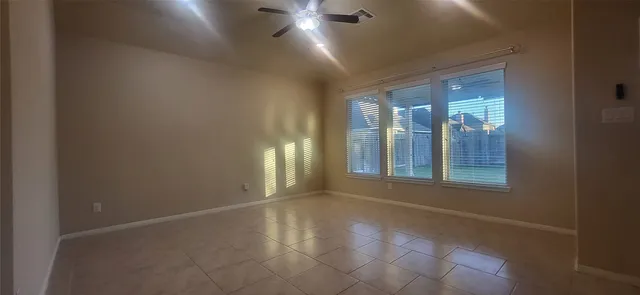 an empty room with windows and entrance