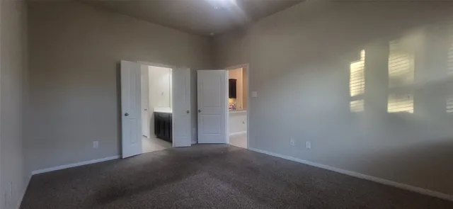 a bathroom with a double vanity sink a mirror and a bathtub