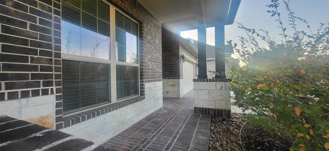 a view of a house with a large window