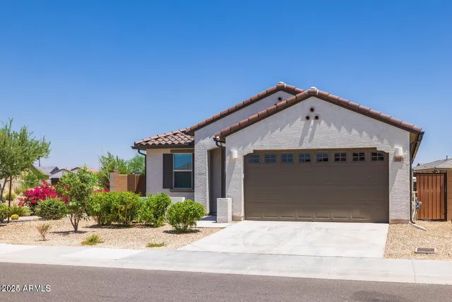 a front view of a house with garage