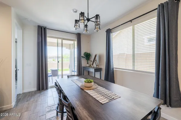 a view of a dining room with furniture window and outside view
