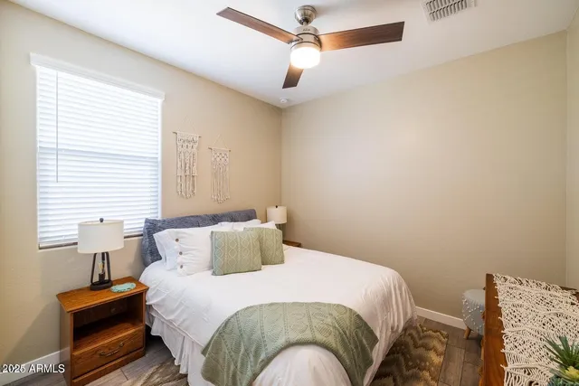 a bedroom with a bed and a window