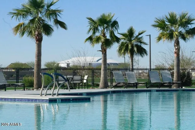 a view of a building with car parked