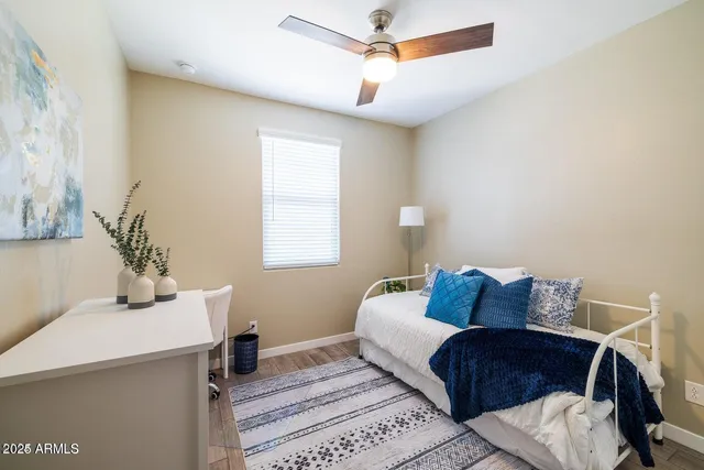 a bedroom with a bed and a table in it