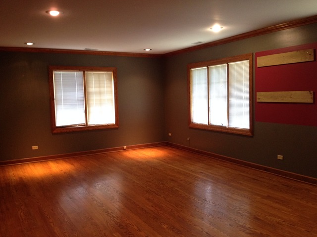 149 Algonquin Road Zion, IL 60099 - Photo 18 of 25 a view of an empty room with wooden floor and a window