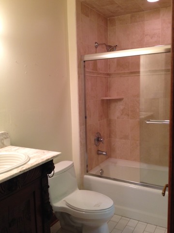 149 Algonquin Road Zion, IL 60099 - Photo 23 of 25 a bathroom with a sink a toilet and shower