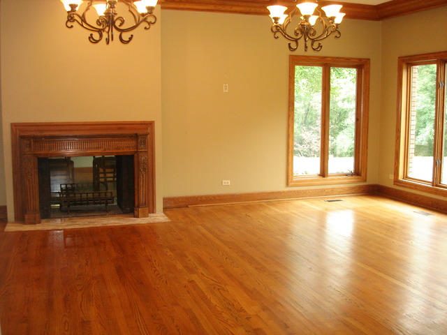 149 Algonquin Road Zion, IL 60099 - Photo 4 of 25 a view of an empty room with a fireplace and a chandelier