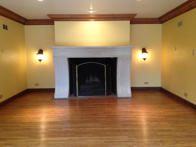 149 Algonquin Road Zion, IL 60099 - Photo 6 of 25 a view of empty room with wooden floor and fireplace