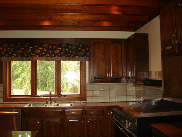 149 Algonquin Road Zion, IL 60099 - Photo 10 of 25 a kitchen with a sink a window and cabinets